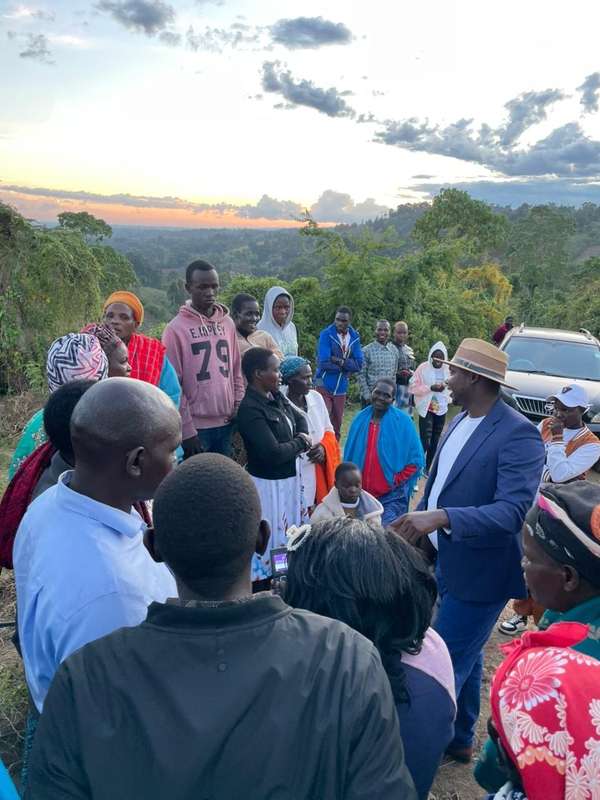 Long’ole talks with women and young people as the sun sets over the valley