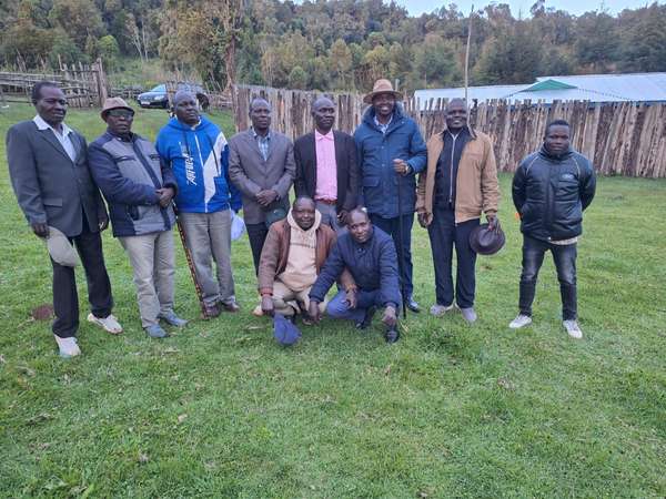 Long’ole with a group of local leaders and elders on a field